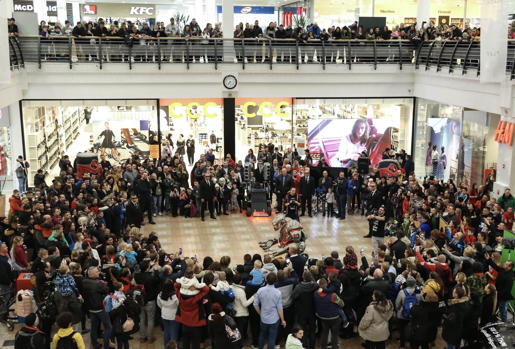 Titan the Robot with a huge crowd at a shopping mall in Budapest, Hungary.
