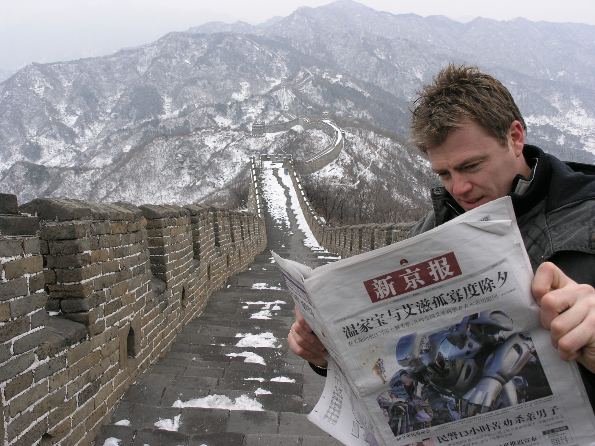 Titan the Robot appears on the front of a newspaper in China. Photo on the Great Wall of China.