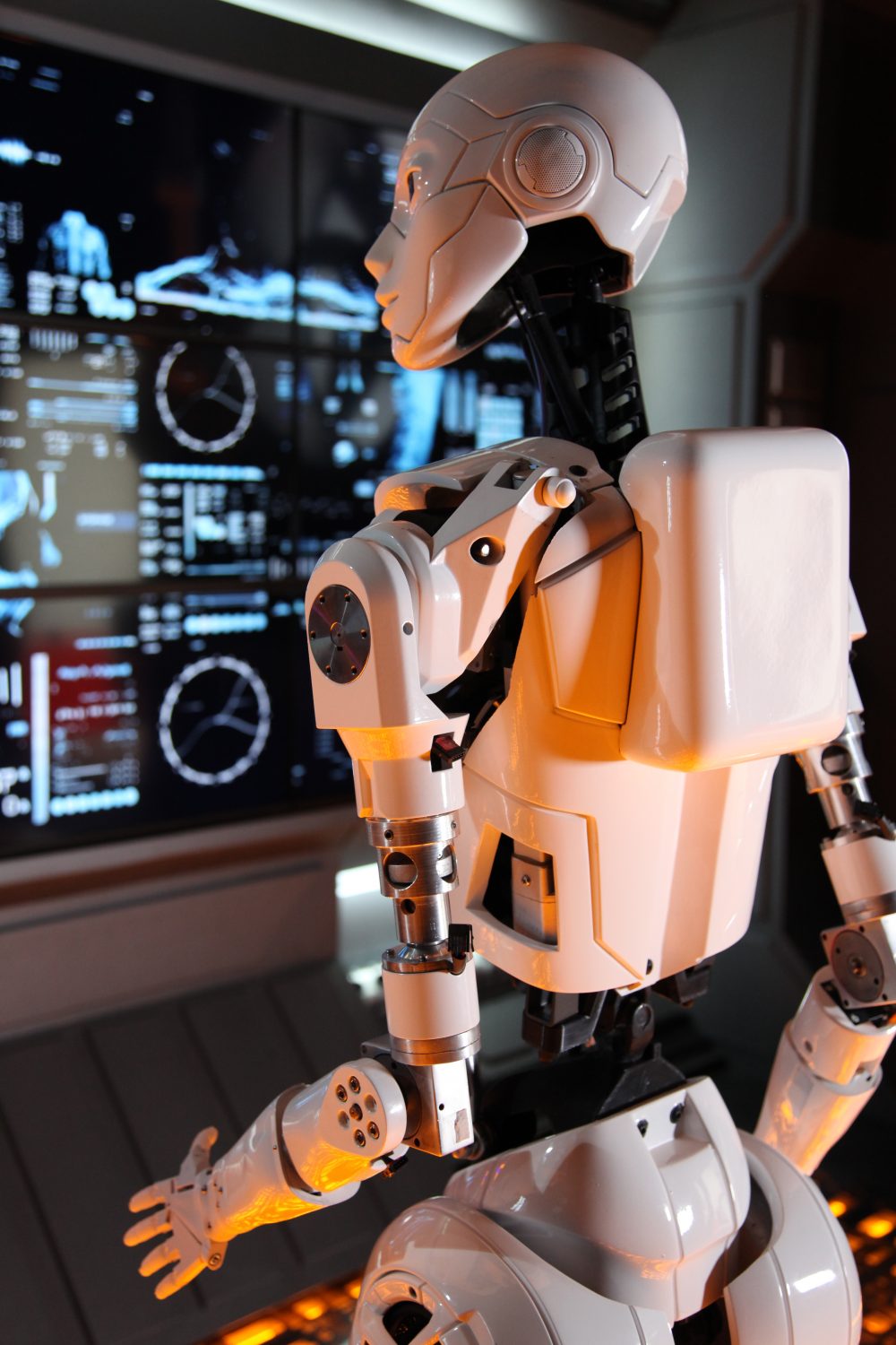 K-na robot looks at the main screen in her spaceship.