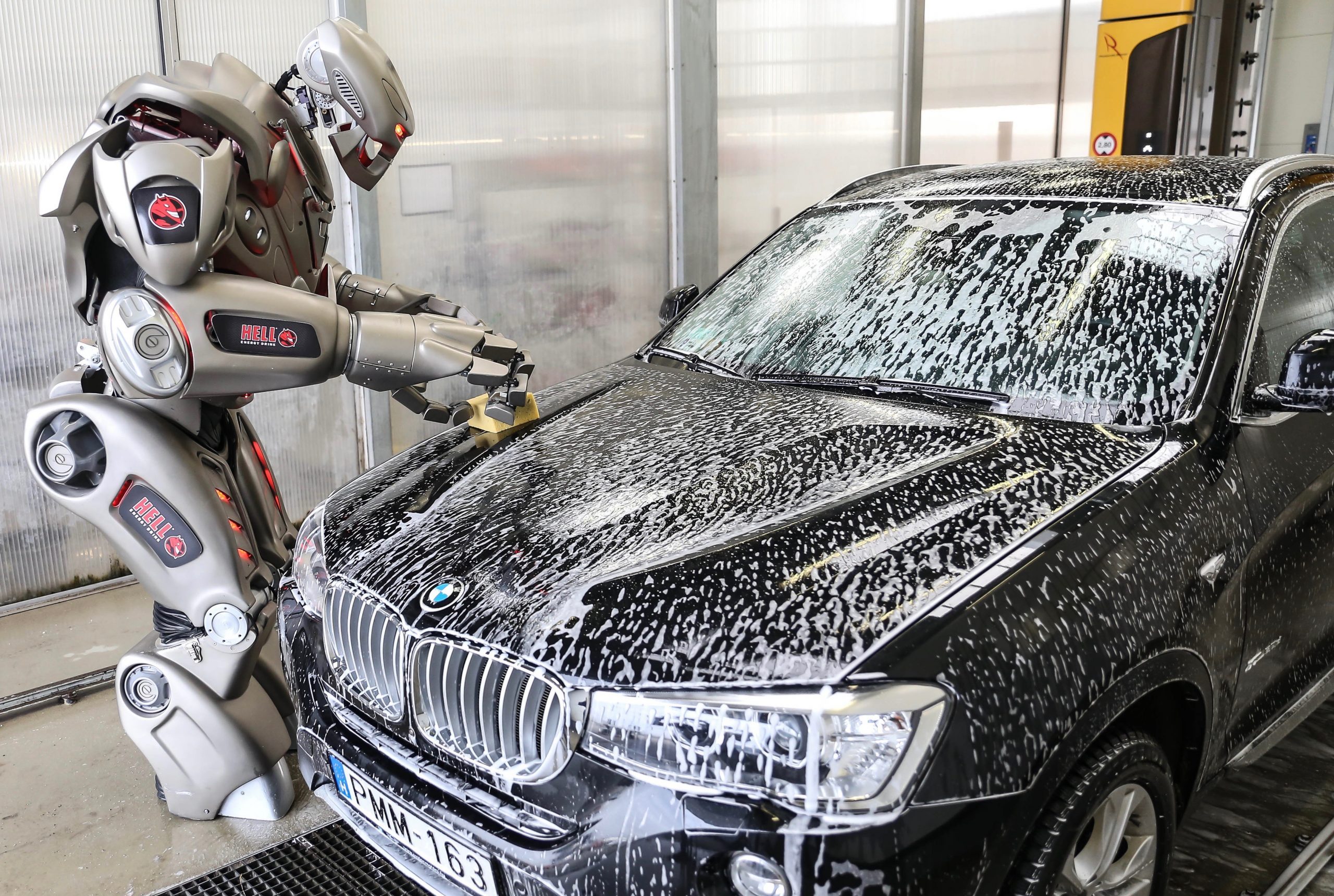 Titan the Robot washing a BMW car in Hungary