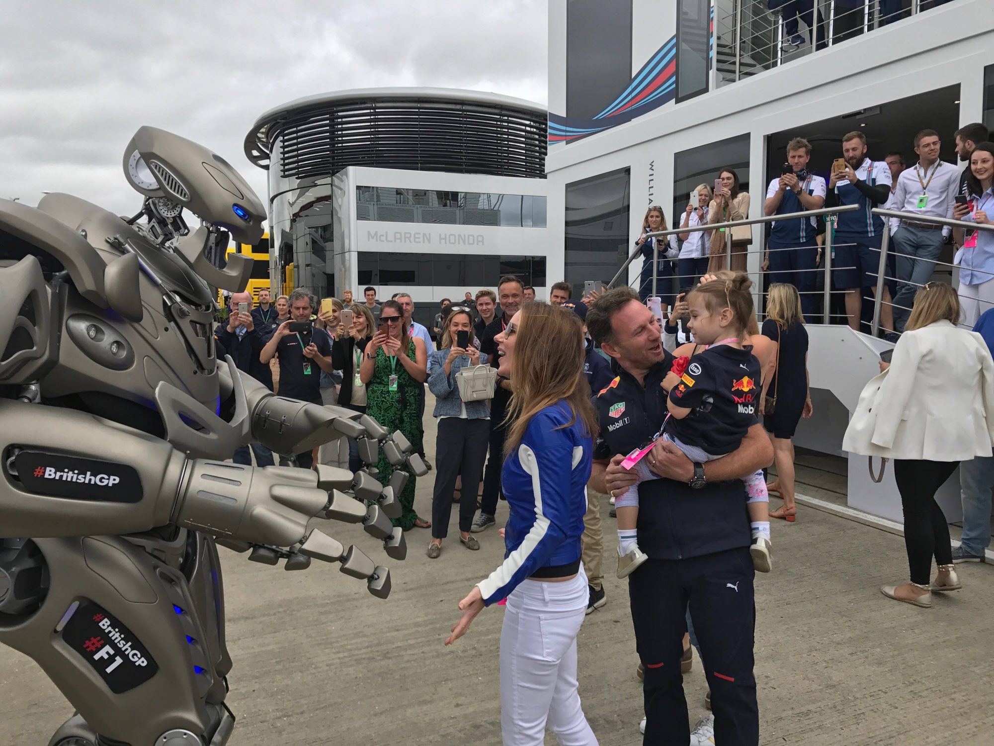 Titan the Robot speaks to Geri Halliwell and Christian Horner in the paddock at the British F1 Grand Prix.